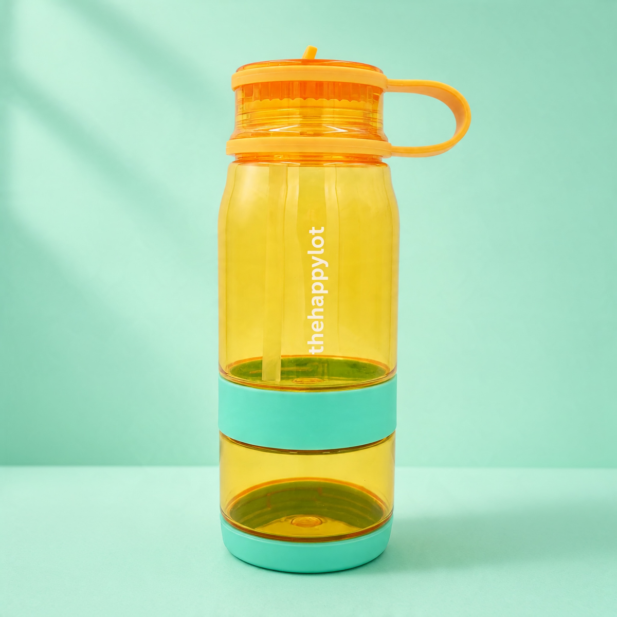 Two and one water bottle with nut cup orange mango, splash cour away front view