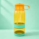 Two and one water bottle with nut cup orange mango, splash cour away front view