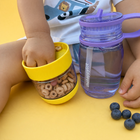 Children’s water bottle with a detachable snack cup with Cheerios inside and a silicon ring so snacks do not fall out